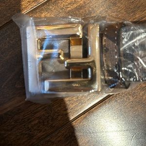 Brand new belt. Design on both sides. With box